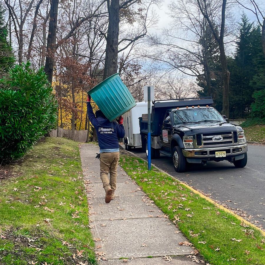Angelscape crew member on fall cleanup job in Bergen County NJ
